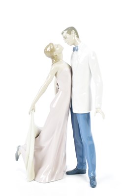 Lot 1232 - LLADRO; a figure, "Happy Anniversary", height...