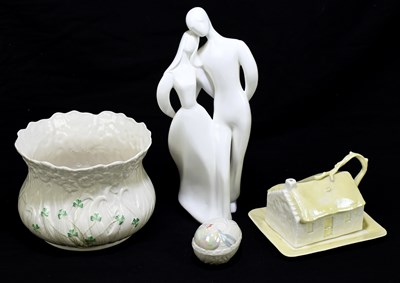 Lot 799 - BELLEEK; a jardinière moulded with flowers and...