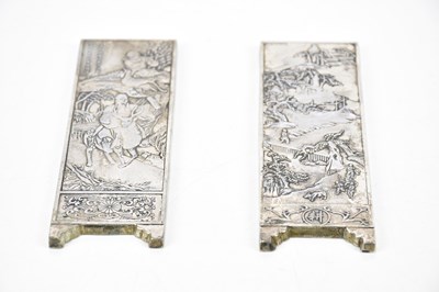 Lot 1048 - A pair Chinese white metal plaques, each...