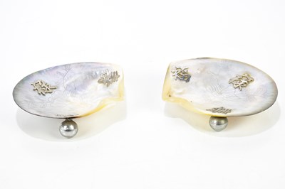 Lot 1037 - A pair of abalone shell and white metal dishes...