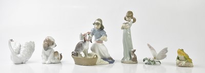 Lot 1234 - LLADRÓ; a model of a girl feeding a sick puppy,...