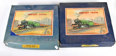 Lot 4337 - HORNBY; two boxed tin plate part train sets,...