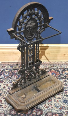 Lot 1215 - A cast iron stick stand, the base with canted...