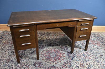 Lot 42 - ABBESS; an oak knee-hole desk, with an...