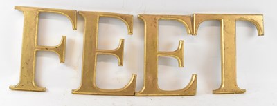 Lot 302 - FEET; a group of four gilt decorated letters.
