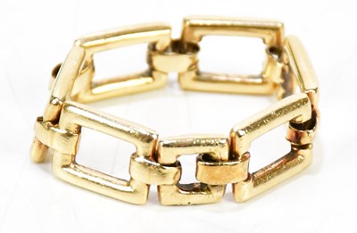 Lot 1131 - A yellow metal link ring, presented in...