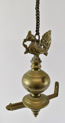 Lot 453 - An Indian brass hanging oil lamp with bird...