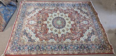 Lot 325 - A red ground Shiraz carpet, with central...