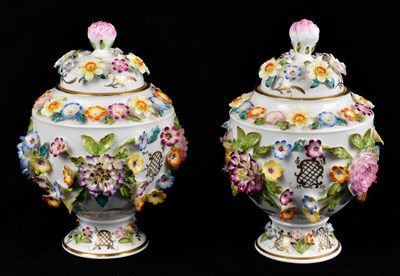Lot 833 - COALPORT; a pair of floral encrusted vases and...