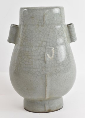 Lot 587 - A Chinese celadon glazed Guan type vase,...