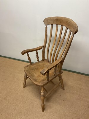 Lot 523 - A beech farmhouse chair, height 115cm.