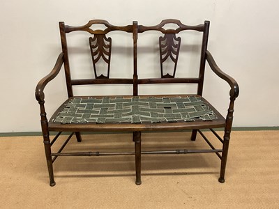 Lot 534 - A double elbow chair, width 164cm.