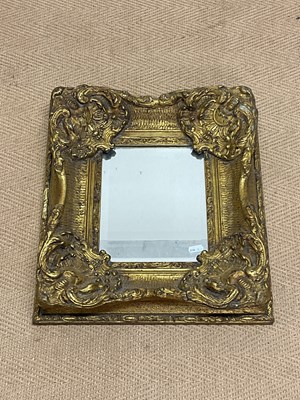 Lot 483 - A decorative gilt mirror, 24 x 18cm.