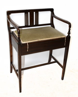 Lot 1547 - An Edwardian mahogany piano stool on tapered...