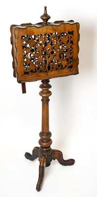 Lot 1699 - A Victorian walnut duet music stand, with...