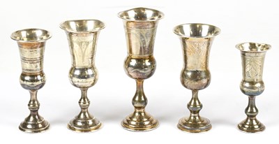 Lot 2258 - Five hallmarked silver Kiddush cups, the...