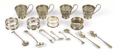Lot 2382 - Four sterling silver pierced cup holders,...