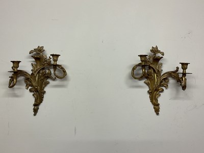 Lot 267 - A pair of gilt brass two branch wall lights in...
