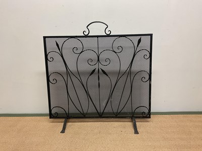 Lot 502 - A wrought iron black fire guard, height 75cm,...