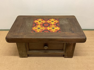 Lot 544 - A coffee table with drawer and tile top, width...
