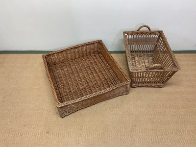 Lot 503 - A wicker laundry basket and a large square...