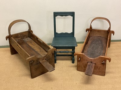 Lot 505 - A pair of Albanian wooden cradles carved with...