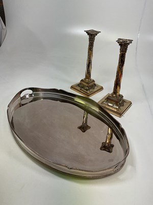 Lot 280 - A silver plated tray and two candlesticks (3).