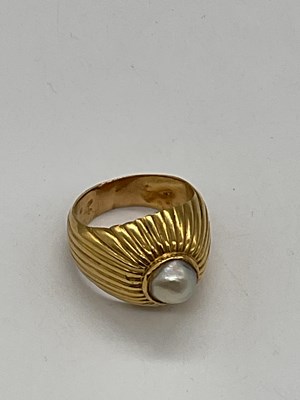 Lot 329 - A yellow metal pearl set domed ring, size M,...