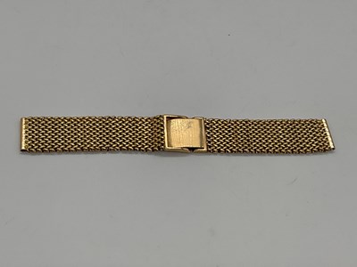 Lot 310 - A yellow metal watch strap with simple clasp,...