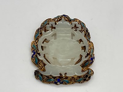 Lot 318 - A Chinese pale jade plaque brooch in silver...
