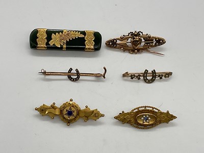 Lot 333 - Six Edwardian yellow metal brooches, one set...
