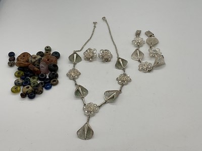Lot 359 - A group of loose Egyptian beads, a filigree...