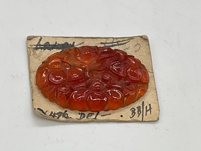 Lot 351 - An unusual floral carved single carnelian oval...