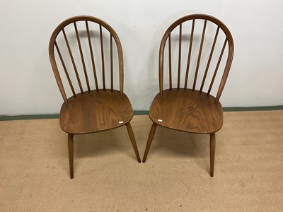 Lot 506 - ERCOL; two hoop back chairs, height 88cm.