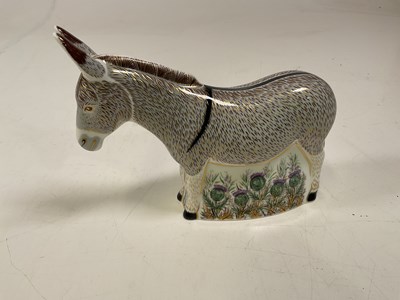 Lot 204 - ROYAL CROWN DERBY; a donkey paperweight with...