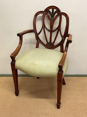 Lot 565 - A carver chair with fleur-de-lys back.