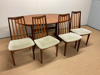 Lot 466 - G PLAN; a dining table and four dining chairs,...