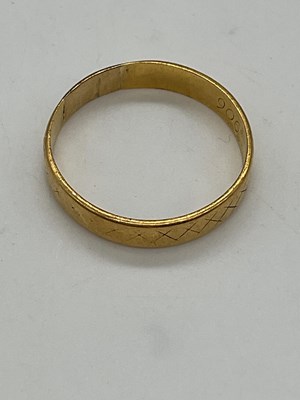 Lot 340 - A 22ct yellow gold wedding band, London 1968,...