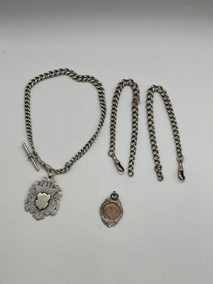 Lot 364 - A graduated silver Albert chain with fob, two...