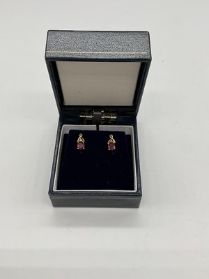 Lot 344 - A pair of 9ct yellow gold ruby and diamond ear...