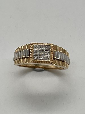 Lot 322 - A yellow metal gentleman's diamond set ring...
