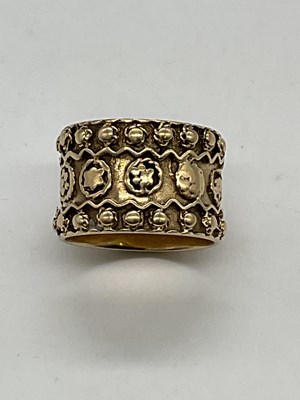 Lot 323 - A 9ct yellow gold broad oval ring, size L,...