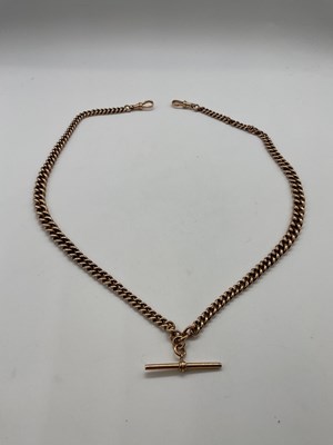 Lot 306 - A 9ct rose gold double Albert fob chain with...