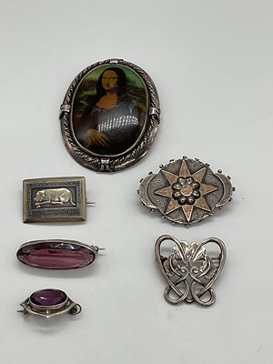 Lot 355 - Six white metal and silver brooches including...