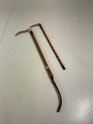 Lot 39 - Two horn handled and silver collared sticks,...