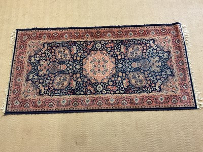 Lot 427 - A small rug, 178 x 90cm.