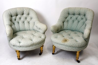 Lot 1633 - A pair of buttoned armchairs upholstered in a...