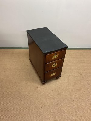 Lot 519 - A pedestal set of three drawers from a desk,...