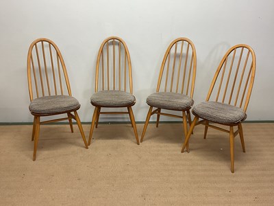 Lot 485 - ERCOL; four Windsor light blonde dining chairs,...