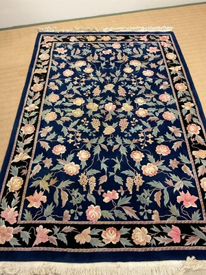 Lot 424 - A floral rug, 278 x 184cm.